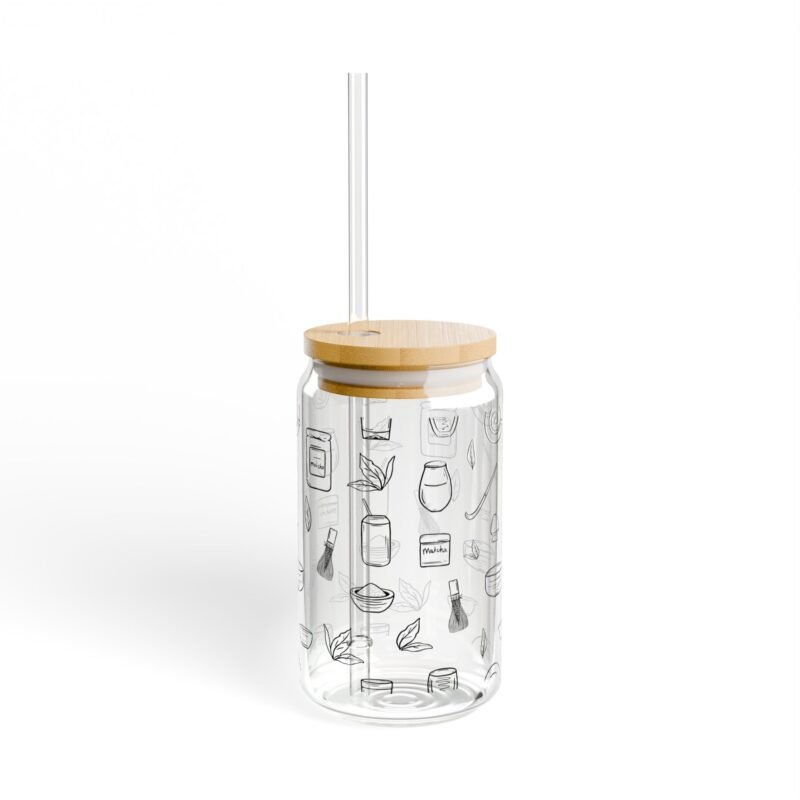 Clear glass tumbler with bamboo lid and straw, decorated with matcha-themed illustrations including matcha drinks, spoon, whisks, mug, and matcha leaves.