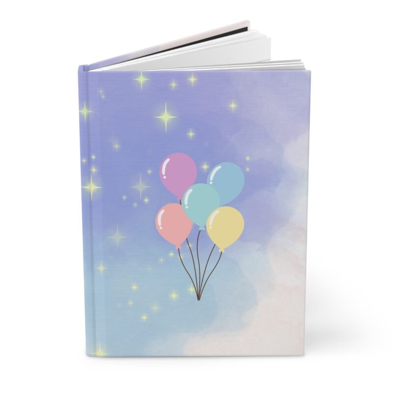 Dreamy purple hardcover journal with pastel balloon illustration