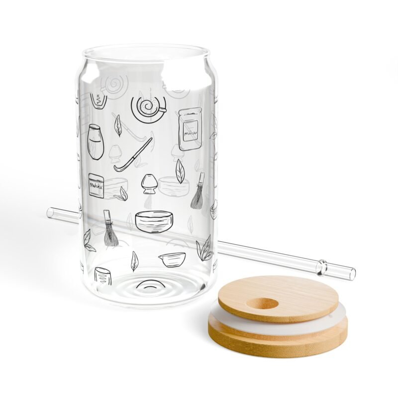 Clear glass tumbler with bamboo lid and straw, decorated with matcha-themed illustrations including matcha drinks, spoon, whisks, mug, and matcha leaves.