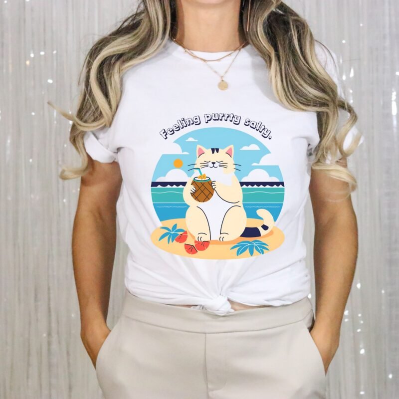 White color T-shirt with the phrase ‘Feeling purrty salty’ printed above a cat drinking pina-colada on the beach relaxing illustration