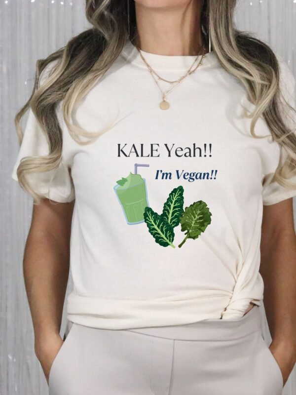 Natural Color T-shirt with the phrase ‘KALE Yeah!! I’m Vegan!!’ printed above a green smoothie and leafy kale illustrations, unisex cotton t shirt