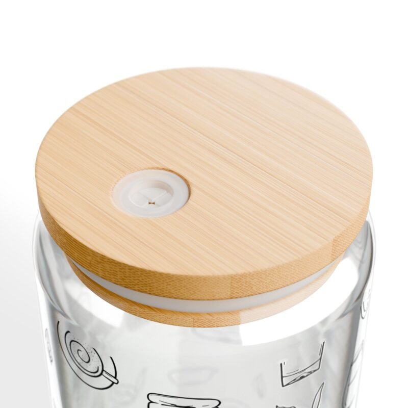 Clear glass tumbler with bamboo lid and straw, decorated with matcha-themed illustrations including matcha drinks, spoon, whisks, mug, and matcha leaves.