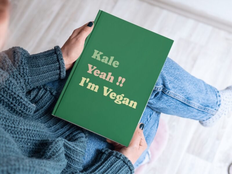 Green hardcover journal with Fun Bold Font featuring the phrase of Kale Yeah!! I'm Vegan on it.