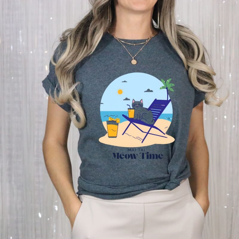 Heather Blue color T-shirt with the phrase ‘Mai Tai, Meow Time’ printed above a cat drinking cocktail on beach chair relaxing by the beach illustration