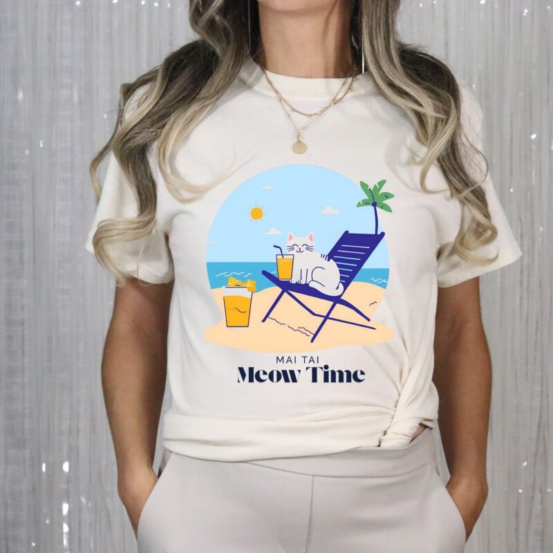 Natural beige color T-shirt with the phrase ‘Mai Tai, Meow Time’ printed above a cat drinking cocktail on beach chair relaxing by the beach illustration
