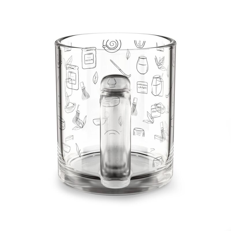 Clear glass mug decorated with matcha-themed illustrations including matcha drinks, spoon, whisks, mug, matcha powder, bamboo tea spoon and matcha leaves.