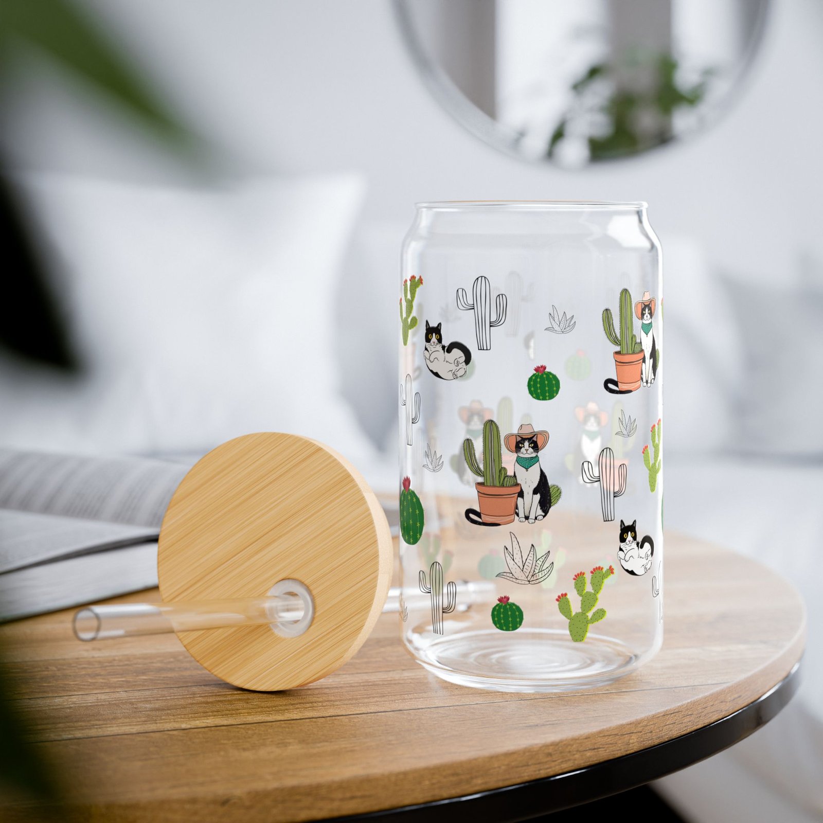 Clear glass tumbler with bamboo lid and straw, decorated with Western desert