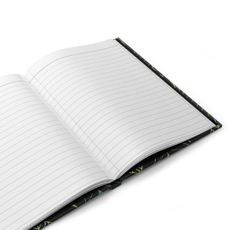 Black hardcover notebook with green and yellow leaf pattern and quote about nourishing the mind and body