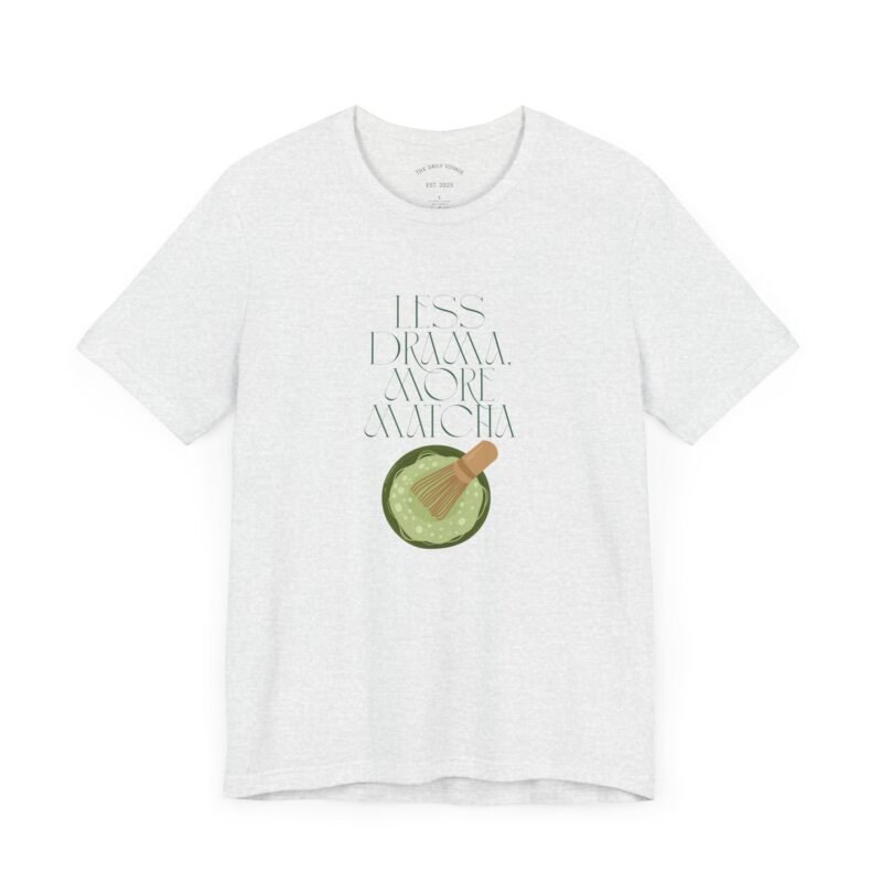 Ash White T-shirt with the phrase ‘Less drama more matcha!!’ printed above a bowl of matcha green tea and tea whisker illustrations, unisex cotton t shirt