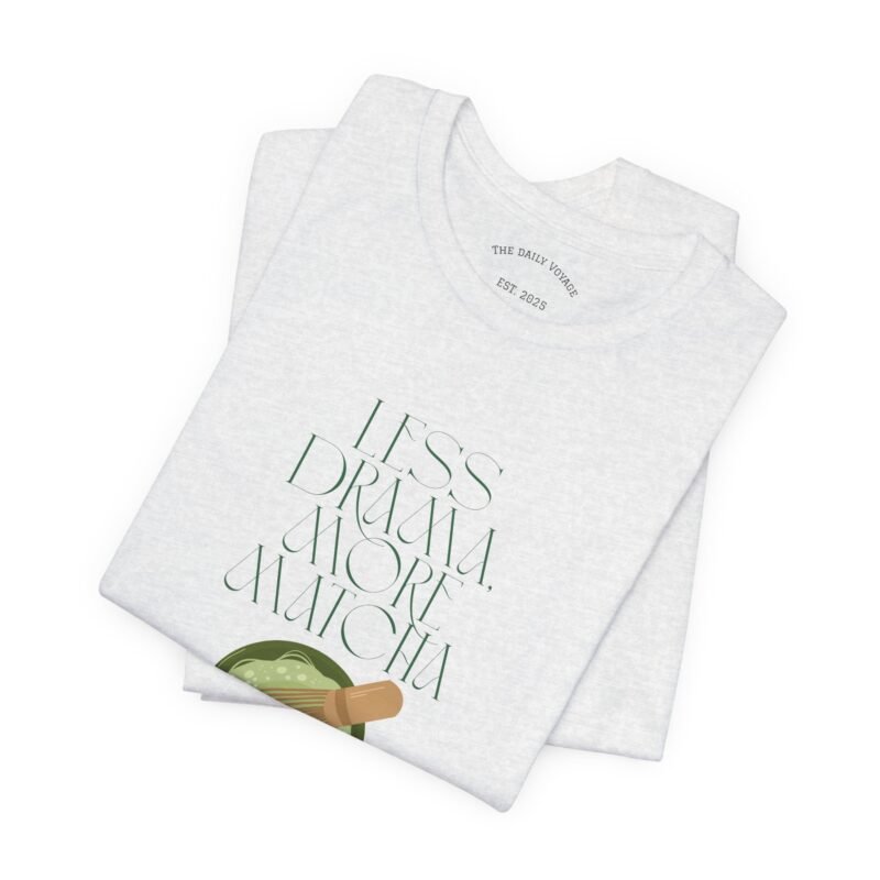 Ash White T-shirt with the phrase ‘Less drama more matcha!!’ printed above a bowl of matcha green tea and tea whisker illustrations, unisex cotton t shirt